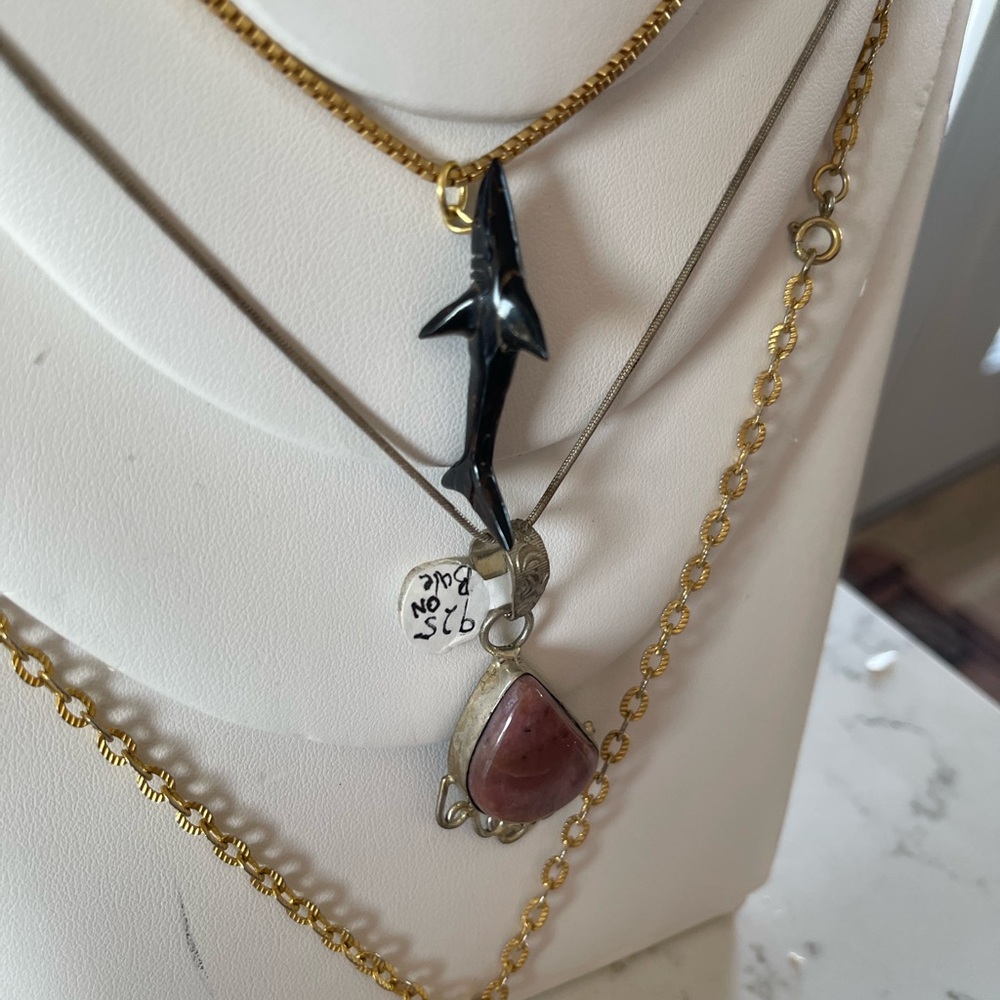 Three Pendant Necklaces with adornments including a shark.